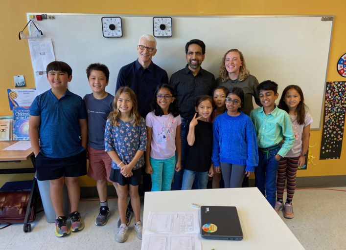 Anderson Cooper from 60 Minutes poses for a photo with Sal Khan and students and a teacher from Khan Lab School.